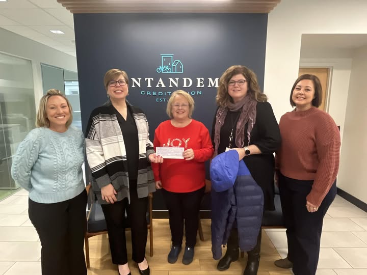 Coat Drive Check Presentation: Jayne VP of Lending, Kristen CEO, Sherri (Coat Drive Liason), Tracy VP of Accounting, and Becky VP of Operations