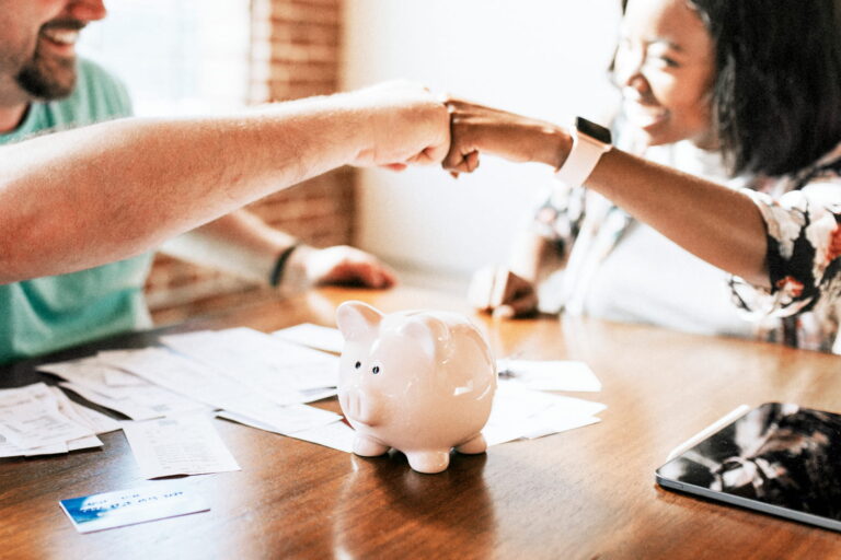 A couple excited to have met their financial goals.