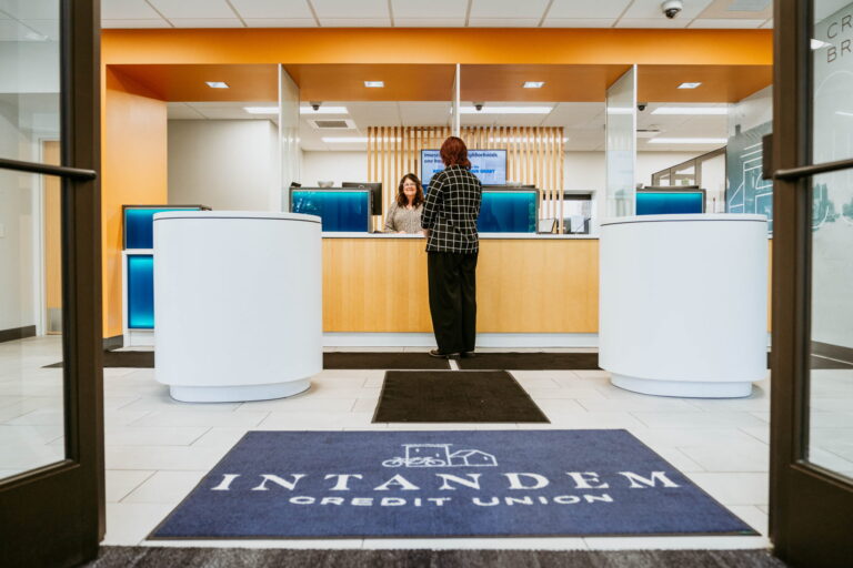 A customer waiting in line at the lobby of Intandem Credit Union.